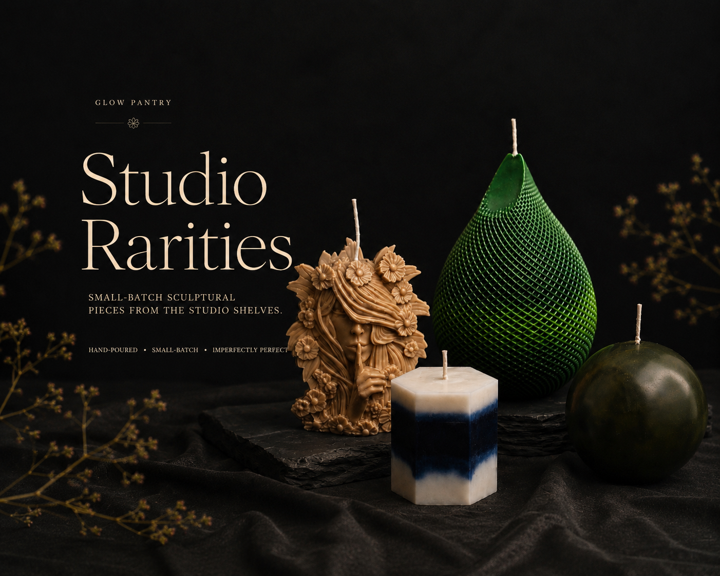 Four handcrafted sculptural candles displayed on a dark editorial background.