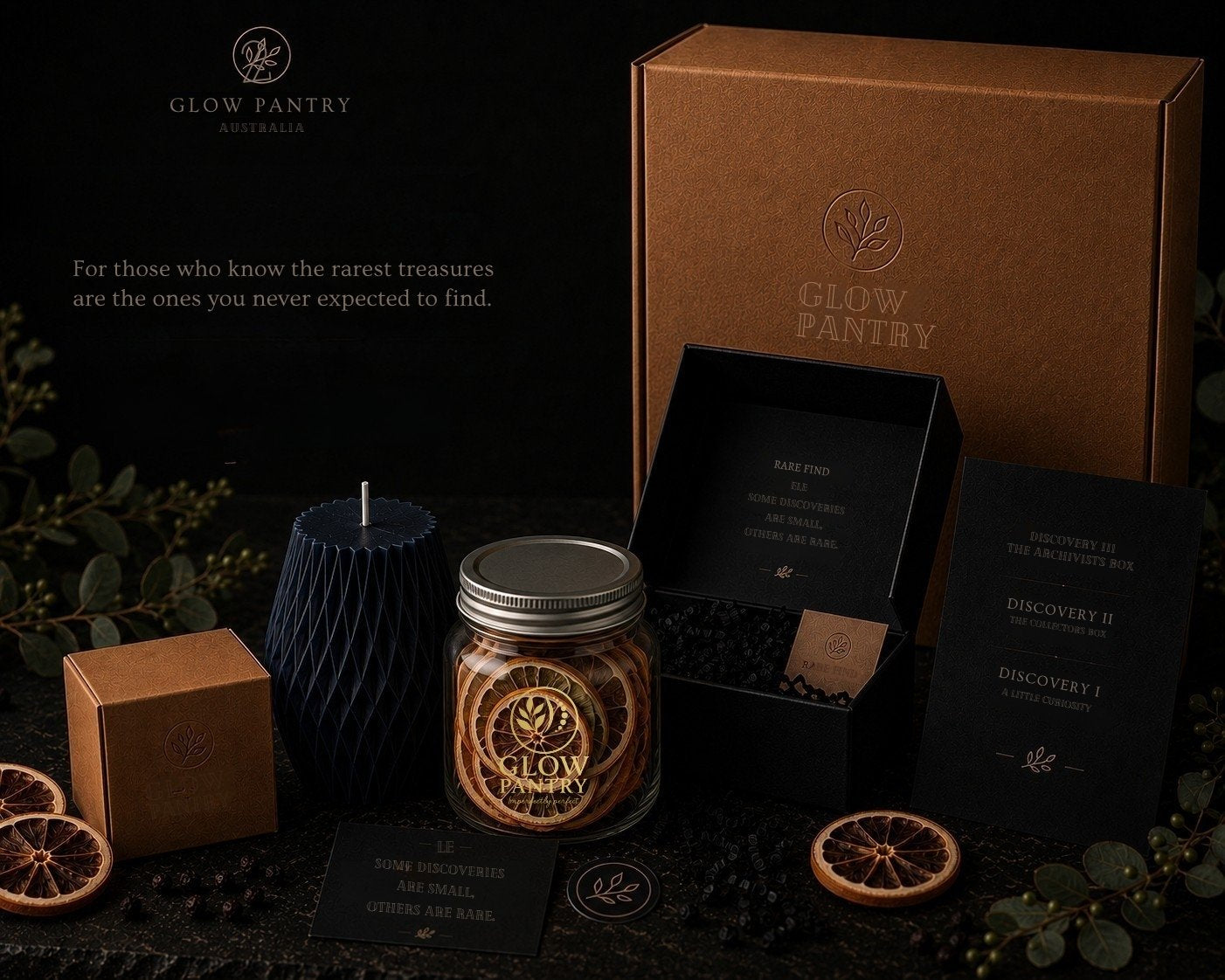 Glow Pantry Archivist’s Box featuring handcrafted candle, dried citrus jar, VLCAD awareness cards and premium gift packaging on a dark botanical backdrop.