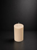 Small ribbed sculptural candle in Cashmere, hand-poured by Glow Pantry.