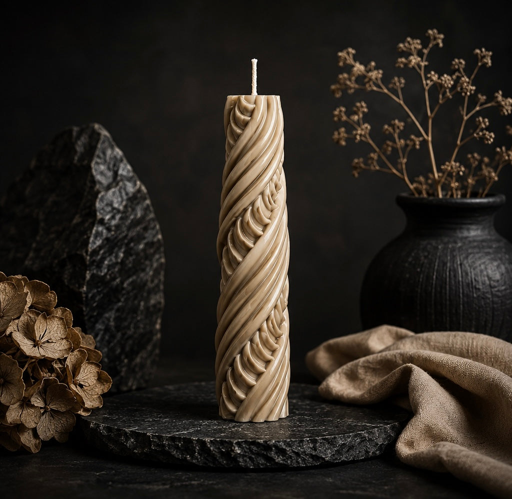 Obsidian Twist sculptural candle in
Cashmere beige featuring intricate carved detailing.