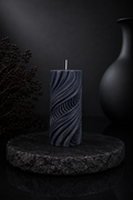 Obsidian Current sculptural candle in Midnight, featuring flowing carved contours and deep charcoal-blue tones from Glow Pantry’s Lowlight Series.