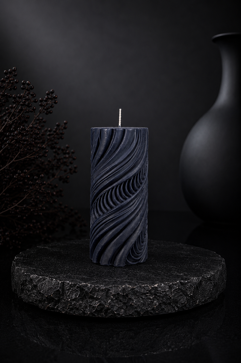 Obsidian Current sculptural candle in Midnight, featuring flowing carved contours and deep charcoal-blue tones from Glow Pantry’s Lowlight Series.