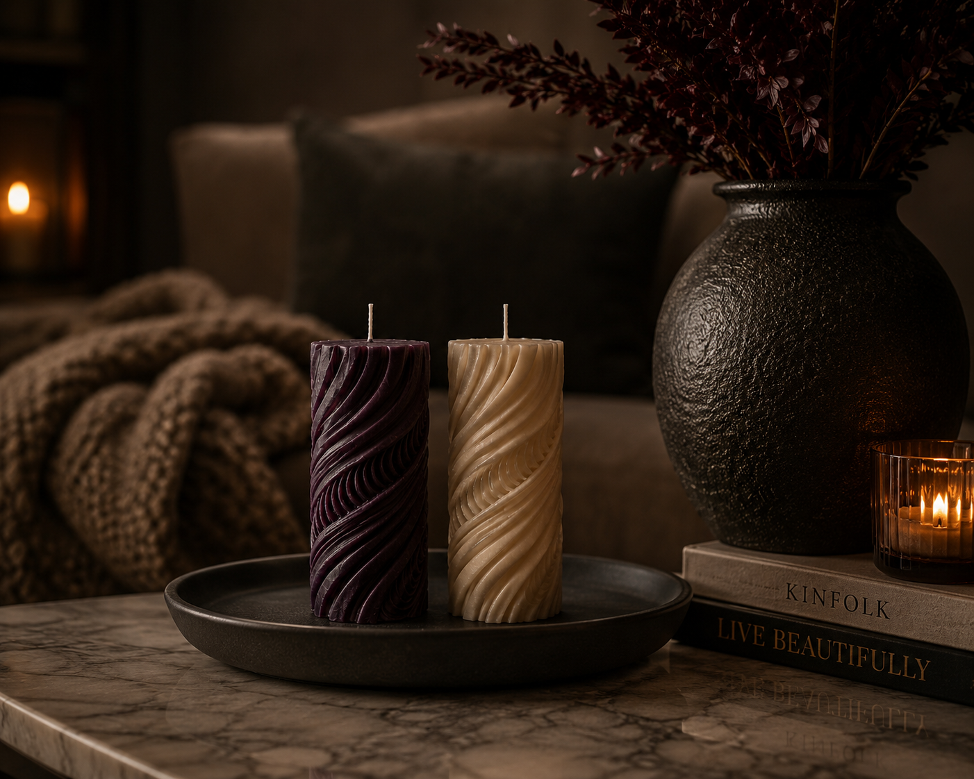 Mulberry and Cashmere Obsidian Current sculptural pillar candles in hand-poured soy wax displayed in a styled home interior.